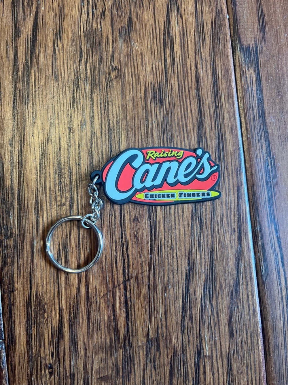 Hot Topic Raising Cane's Logo Keychain - Red, Blue, Yellow, Black